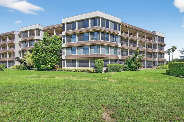 a view of a swimming pool with a lounge chairs