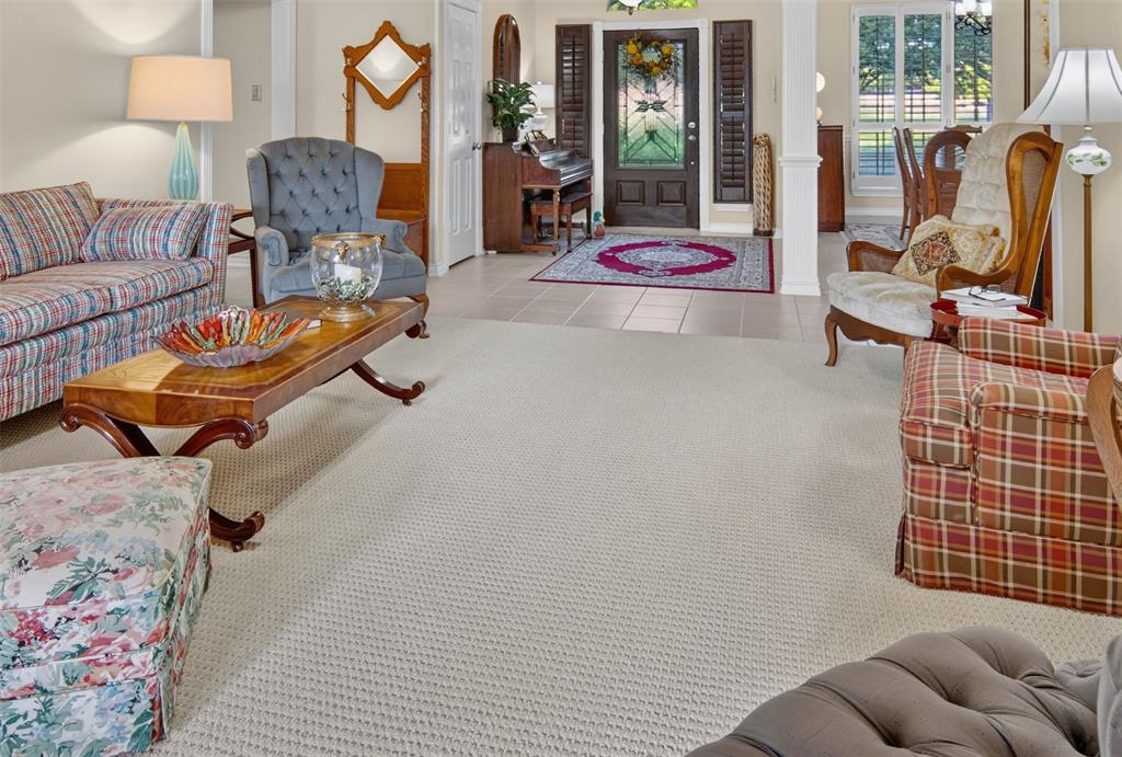 272 Edward Farris Road Weatherford, TX 76085 - Photo 13 of 40 Light-toned carpeted flooring throughout, tile entry, and architectural columns