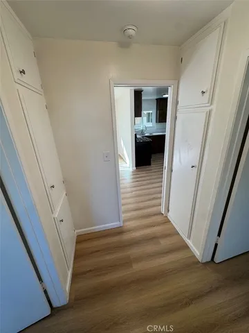 a view of a hallway view with staircase