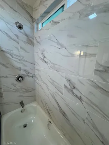 a bathroom with a sink and shower