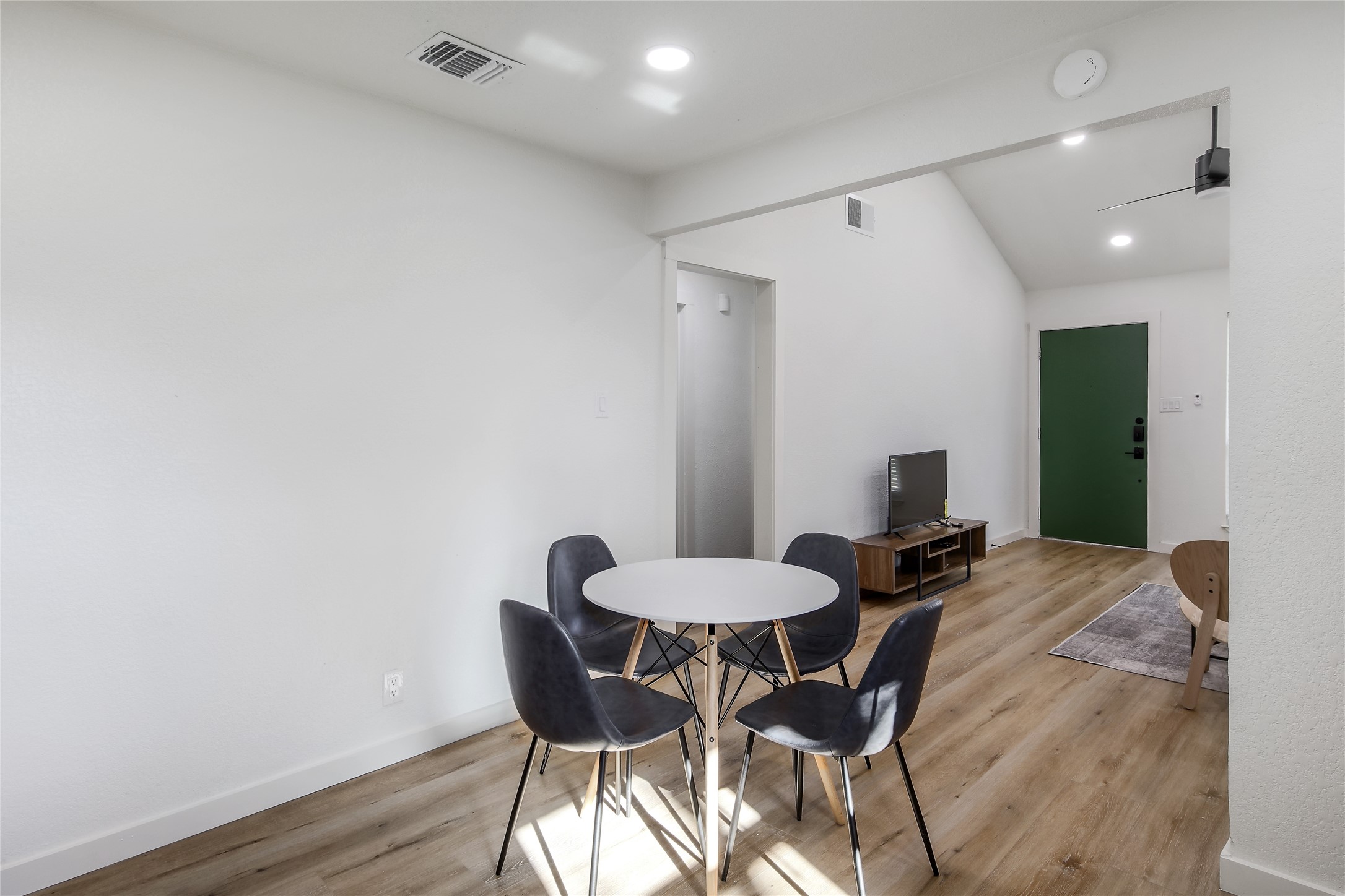 10509 Macmora Road, Unit B Austin, TX 78758 - Photo 9 of 19 a view of a dining room with furniture and wooden floor