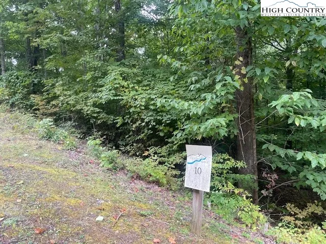 a sign board with a street sign on it