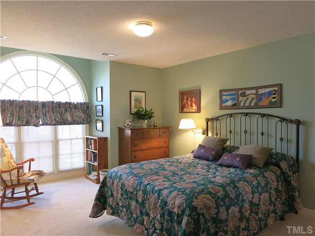 2613 Bembridge Drive Raleigh, NC 27613 - Photo 19 of 25 There are 2 more very spacious Bedrooms up here w/neutral carpet, CF & double closets, and they share the lg hall Bath. This is Bedroom 2 which features a lg arched top window. Bedroom