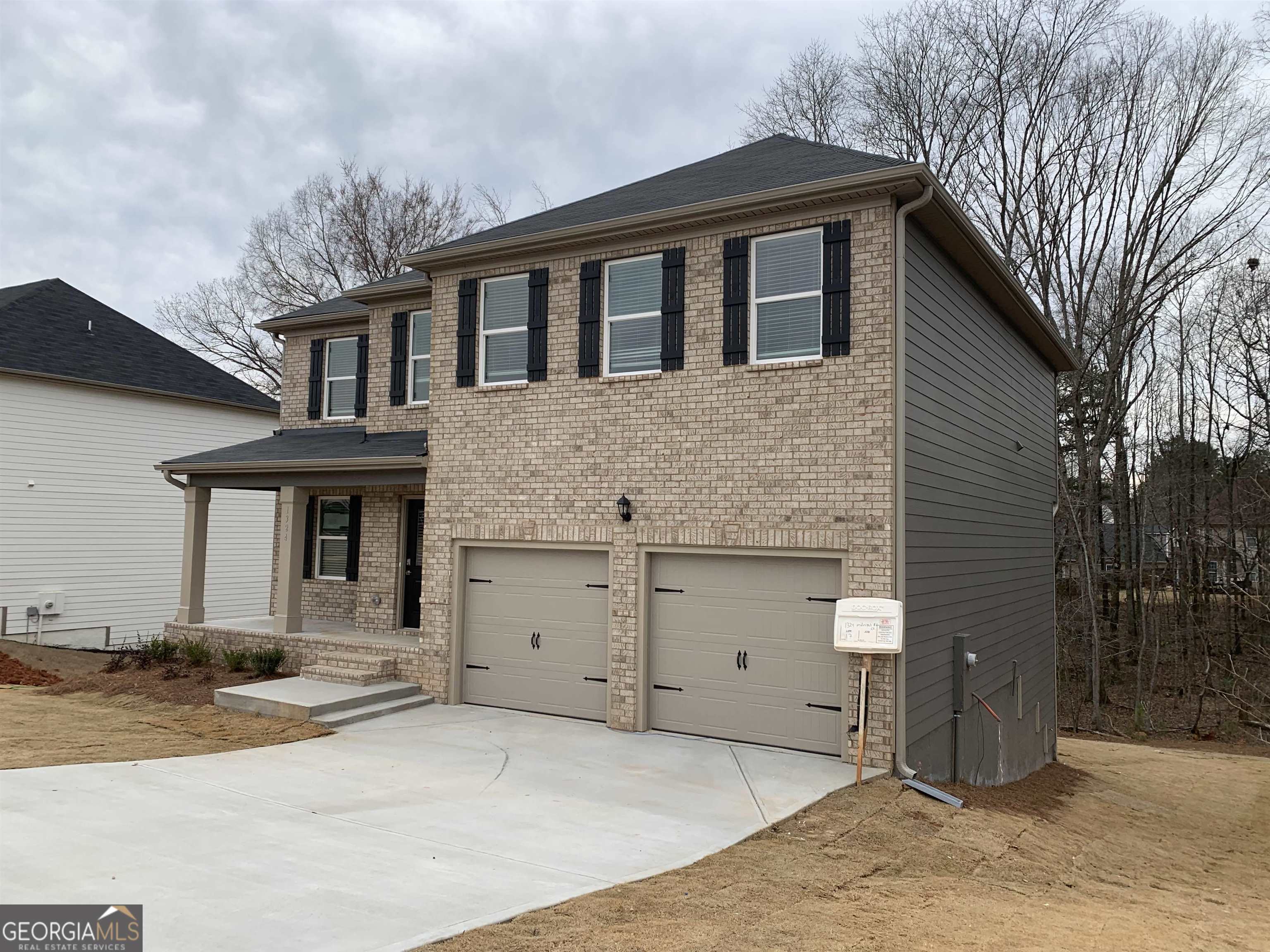 1324 Midnight Ride Drive, Unit 17 Hampton, GA 30228 - Photo 1 of 1 a front view of a house with yard