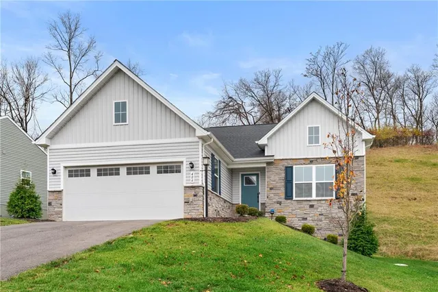 an aerial view of houses with yard
