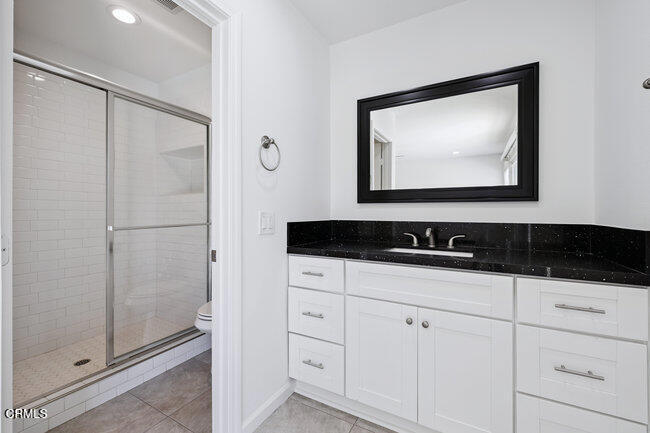 861 Dara Street Camarillo, CA 93010 - Photo 23 of 42 a bathroom with a sink and a mirror