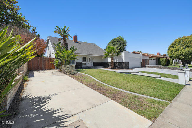 861 Dara Street Camarillo, CA 93010 - Photo 3 of 42 a view of a house with a swimming pool