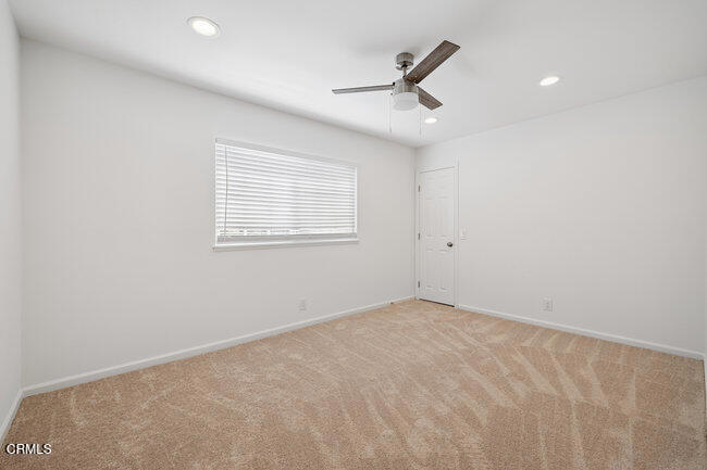 861 Dara Street Camarillo, CA 93010 - Photo 31 of 42 an empty room with a window and a ceiling fan