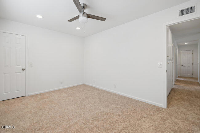 861 Dara Street Camarillo, CA 93010 - Photo 32 of 42 an empty room with a ceiling fan and a window