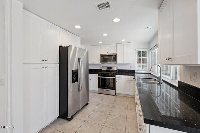 861 Dara Street Camarillo, CA 93010 - Photo 8 of 42 a kitchen with a refrigerator a sink and dishwasher