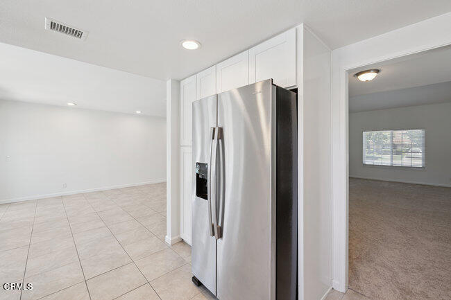 861 Dara Street Camarillo, CA 93010 - Photo 10 of 42 a view of a kitchen with a refrigerator and window