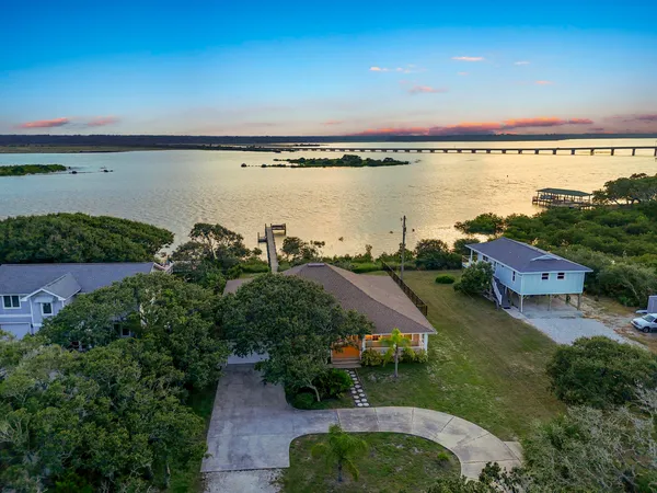 an aerial view of a city and lake view