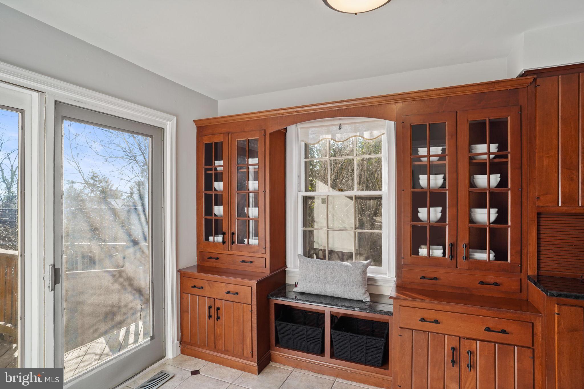 406 West Braddock Road Alexandria, VA 22302 - Photo 11 of 56 a view of a brick wall with a dining table and chairs