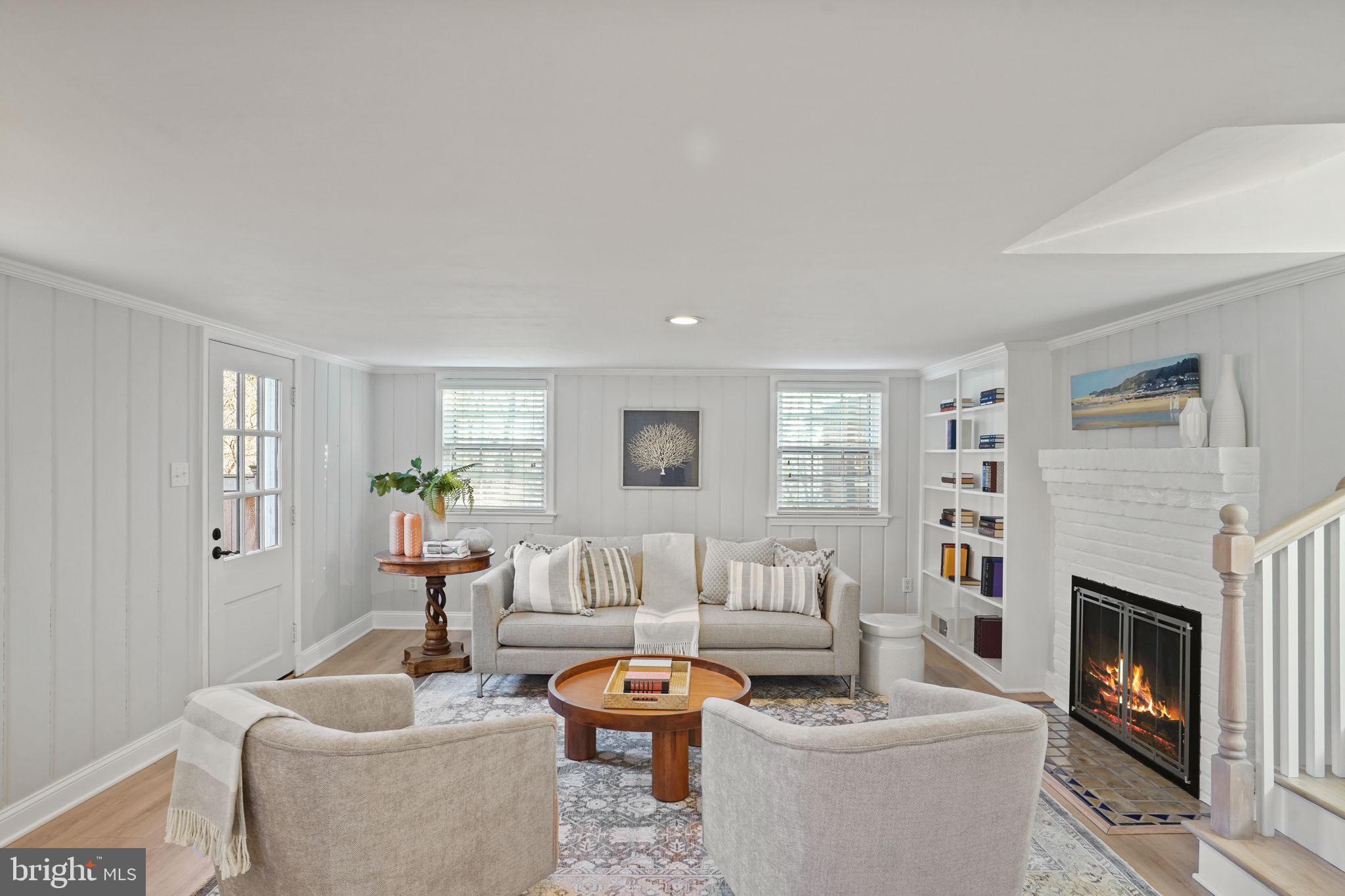 406 West Braddock Road Alexandria, VA 22302 - Photo 17 of 56 a living room with furniture a fireplace and a window