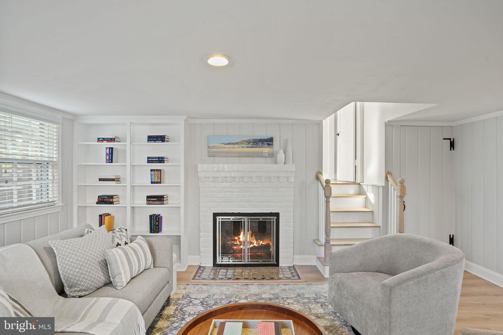 406 West Braddock Road Alexandria, VA 22302 - Photo 19 of 56 a living room with furniture window and a fireplace