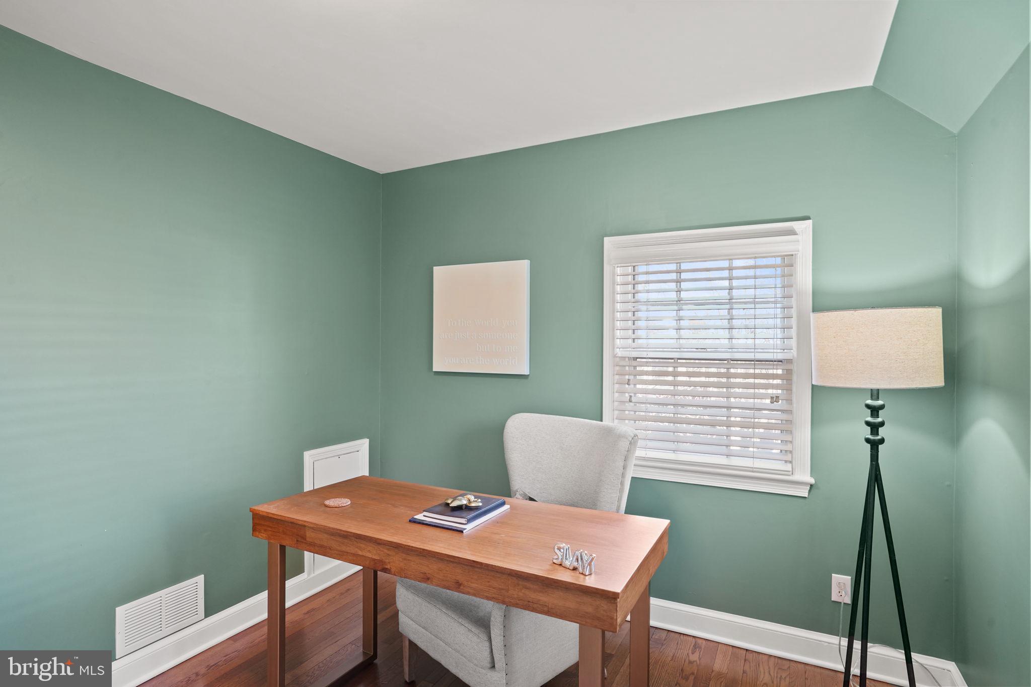 406 West Braddock Road Alexandria, VA 22302 - Photo 22 of 56 a view of a workspace with furniture and a window
