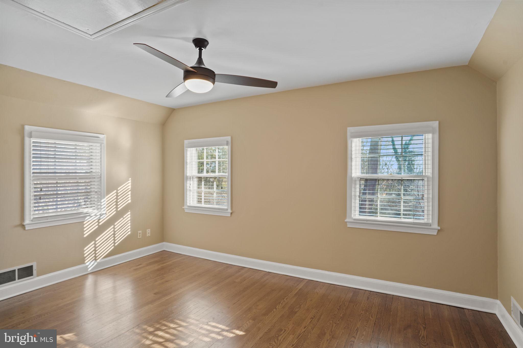 406 West Braddock Road Alexandria, VA 22302 - Photo 25 of 56 a view of an empty room with wooden floor and a window