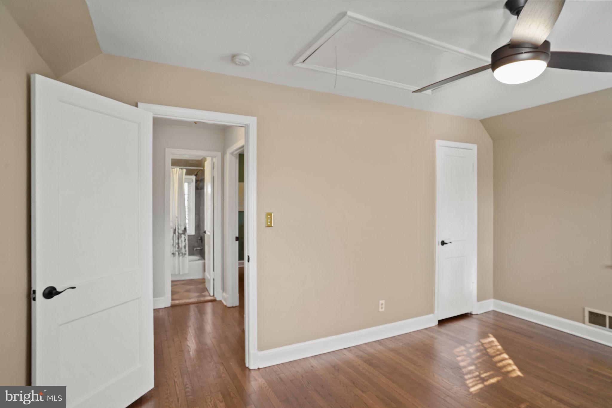 406 West Braddock Road Alexandria, VA 22302 - Photo 26 of 56 an empty room with wooden floor fan and windows