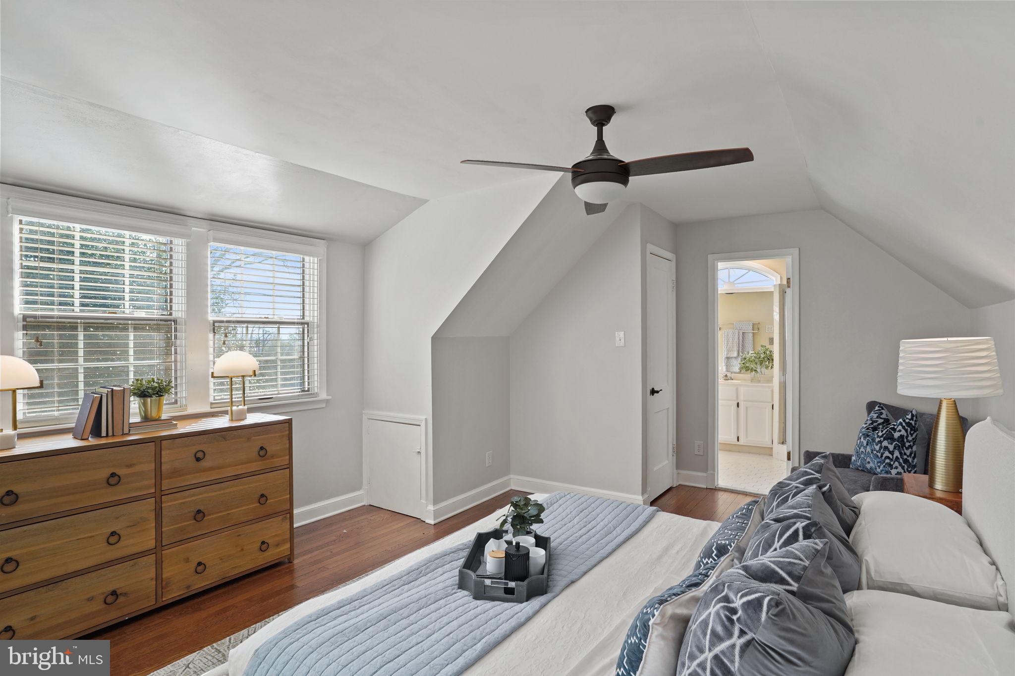 406 West Braddock Road Alexandria, VA 22302 - Photo 28 of 56 a bedroom with a bed and wooden floor