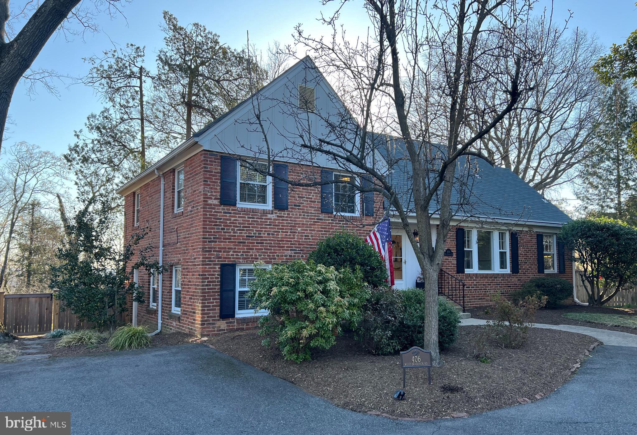 406 West Braddock Road Alexandria, VA 22302 - Photo 50 of 56 a front view of a house with a yard
