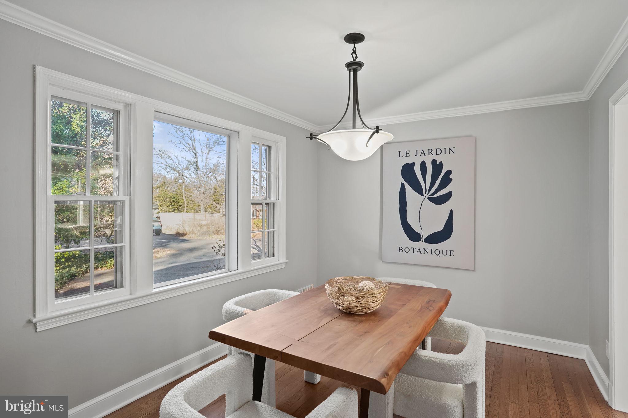 406 West Braddock Road Alexandria, VA 22302 - Photo 10 of 56 a view of a room that has a table and chairs in it