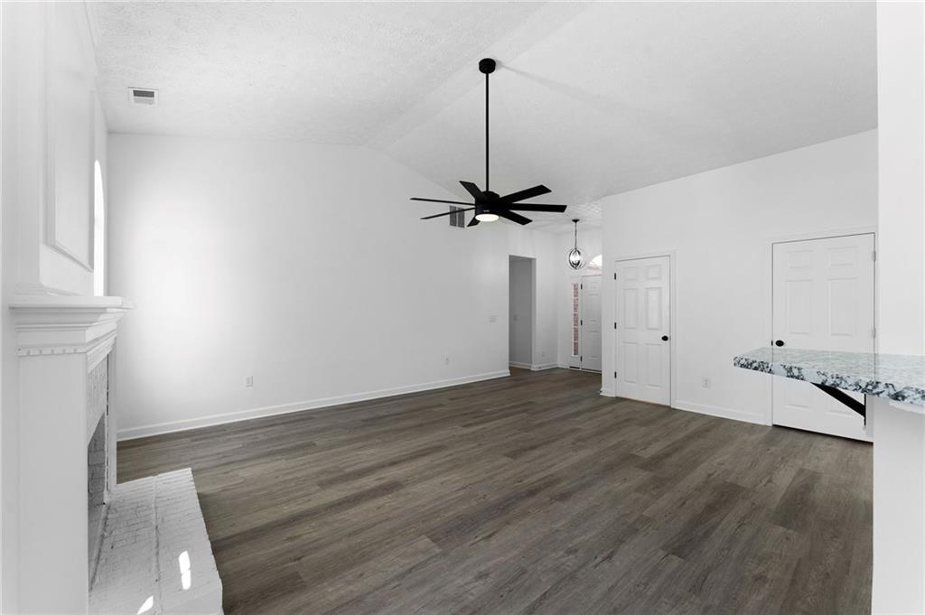 20 Mallet Pointe Street Northeast Cartersville, GA 30121 - Photo 17 of 37 a view of a room with wooden floor and a ceiling fan