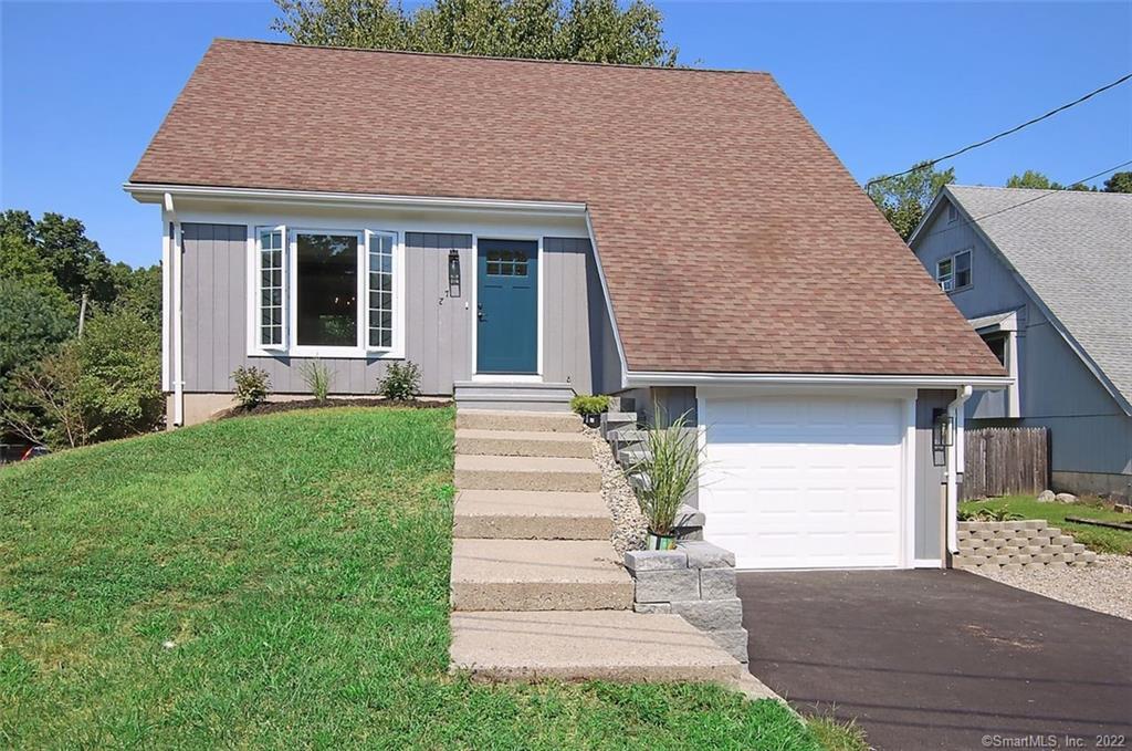 27 Simsberry Road Naugatuck, CT 06770 - Photo 1 of 1 a front view of a house with a yard and garage