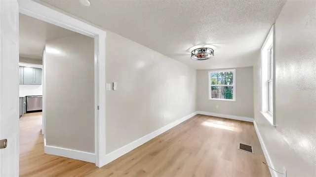 a view of livingroom with hardwood floor and window