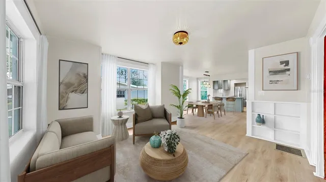 a living room with furniture and a table