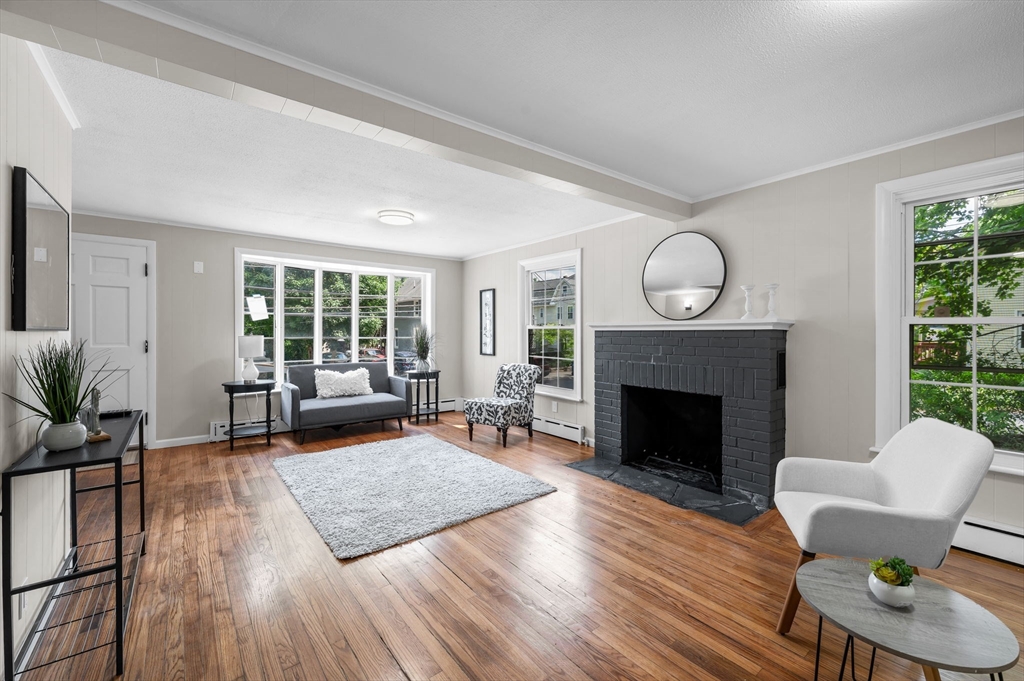 37 Bridge Street Monson, MA 01057 - Photo 27 of 35 a living room with furniture and a fireplace
