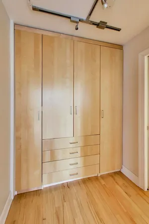 a view of entryway with wooden floor and stairs