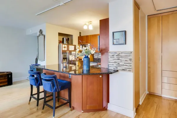 a bedroom with furniture and a flat screen tv