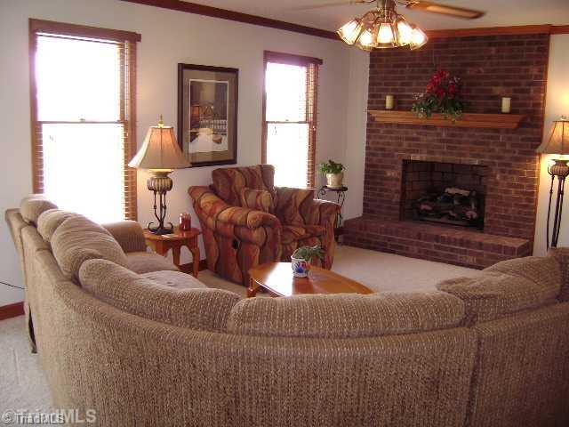 823 Community Road Lexington, NC 27295 - Photo 2 of 16 Exterior Front. Living room with gas log fireplace and crown molding.