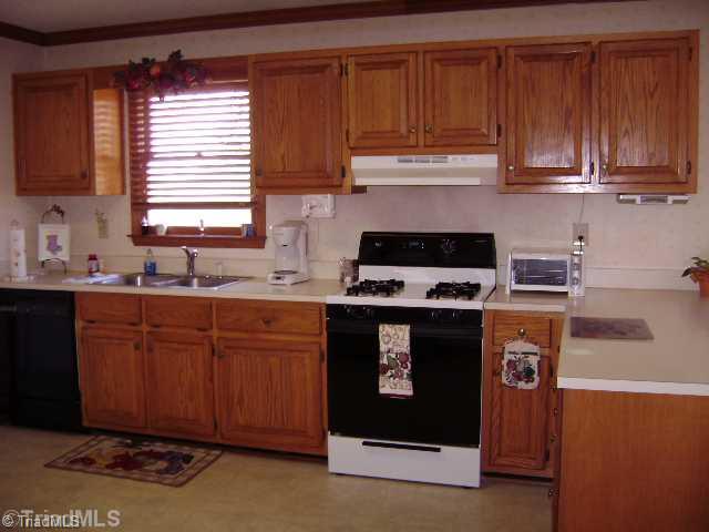 823 Community Road Lexington, NC 27295 - Photo 4 of 16 Exterior Front. Another view of the kitchen.