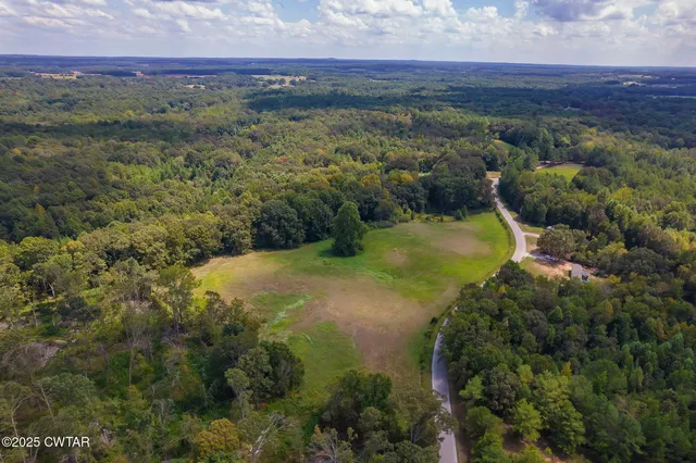 a view of a lake with a yard