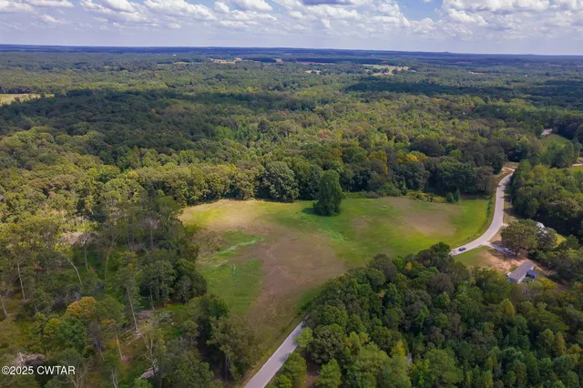 a view of a lake with a yard