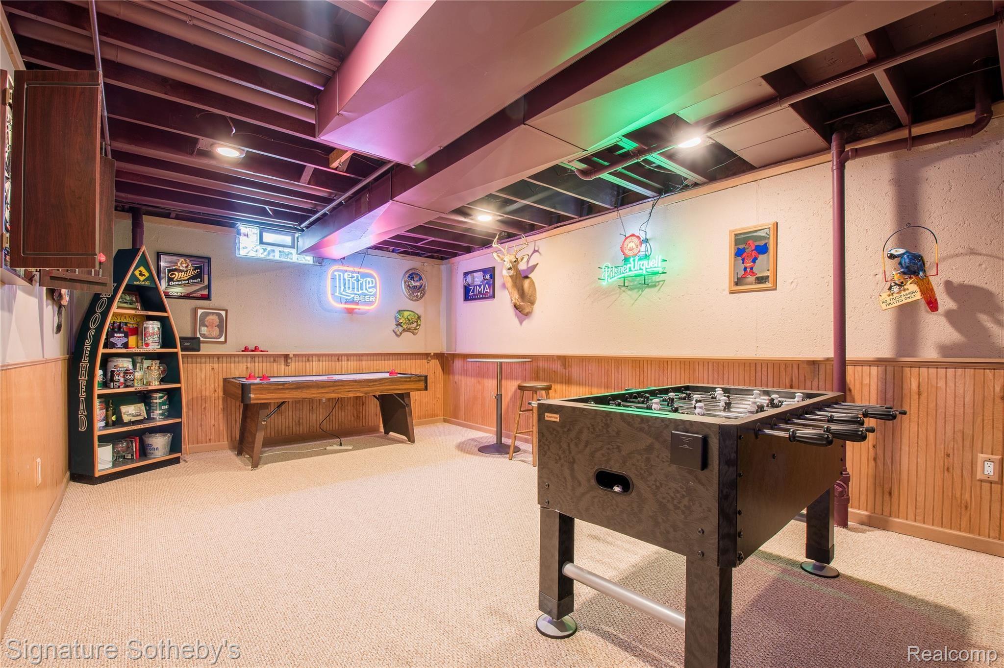 745 West Ridge Court Lake Orion, MI 48359 - Photo 37 of 44 Basement game room foosball table stays