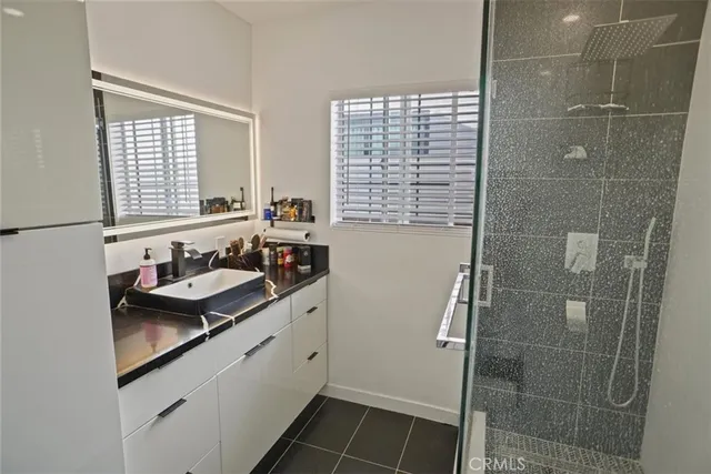 a bathroom with a sink and shower