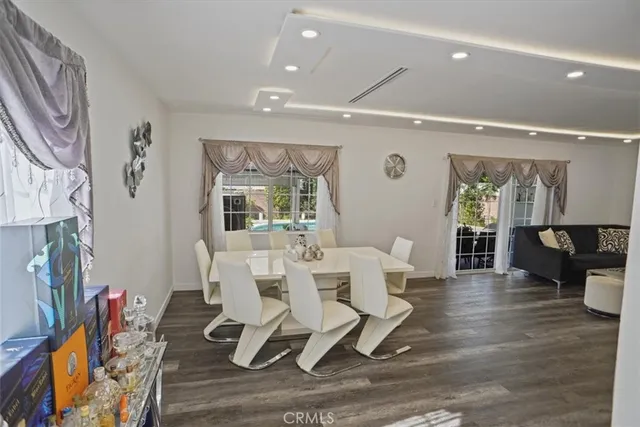 a work room with furniture a rug and a fireplace