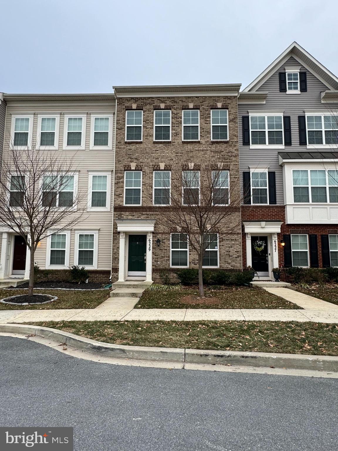 6229 Posey Street Frederick, MD 21703 - Photo 1 of 3 a front view of residential houses
