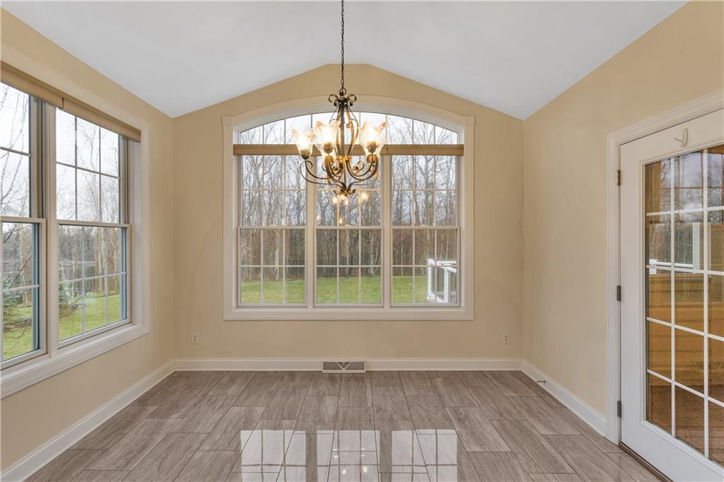 116 James Drive Beaver, PA 15009 - Photo 14 of 44 an empty room with wooden floor and windows