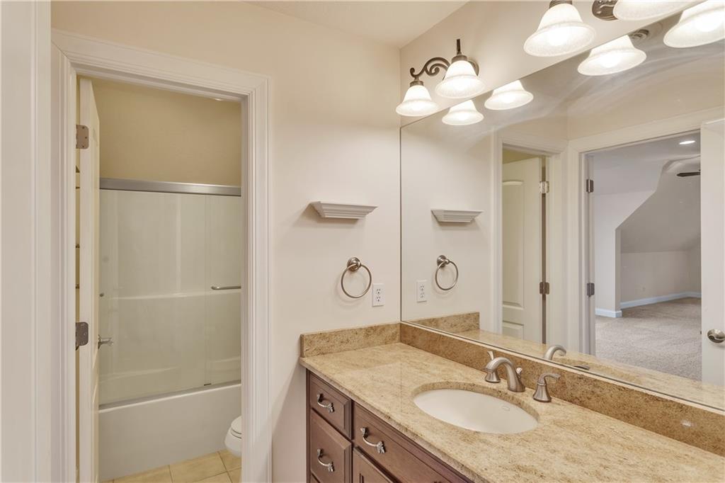 116 James Drive Beaver, PA 15009 - Photo 29 of 44 a bathroom with a granite countertop sink mirror and a shower