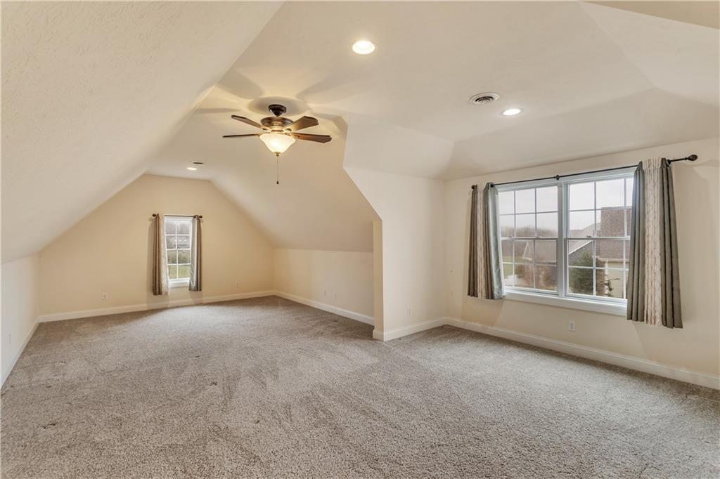 116 James Drive Beaver, PA 15009 - Photo 30 of 44 an empty room with chandelier fan and windows
