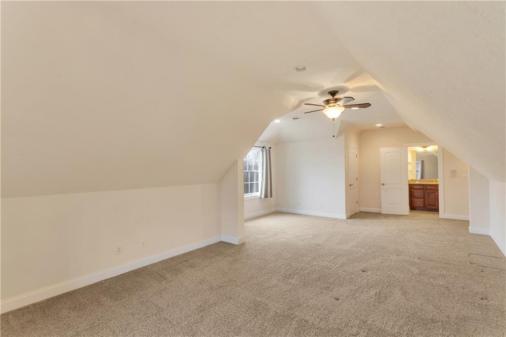 116 James Drive Beaver, PA 15009 - Photo 31 of 44 an empty room with a chandelier fan and windows