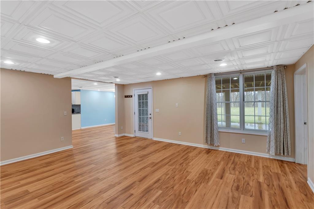 116 James Drive Beaver, PA 15009 - Photo 34 of 44 a view of an empty room with wooden floor and a window