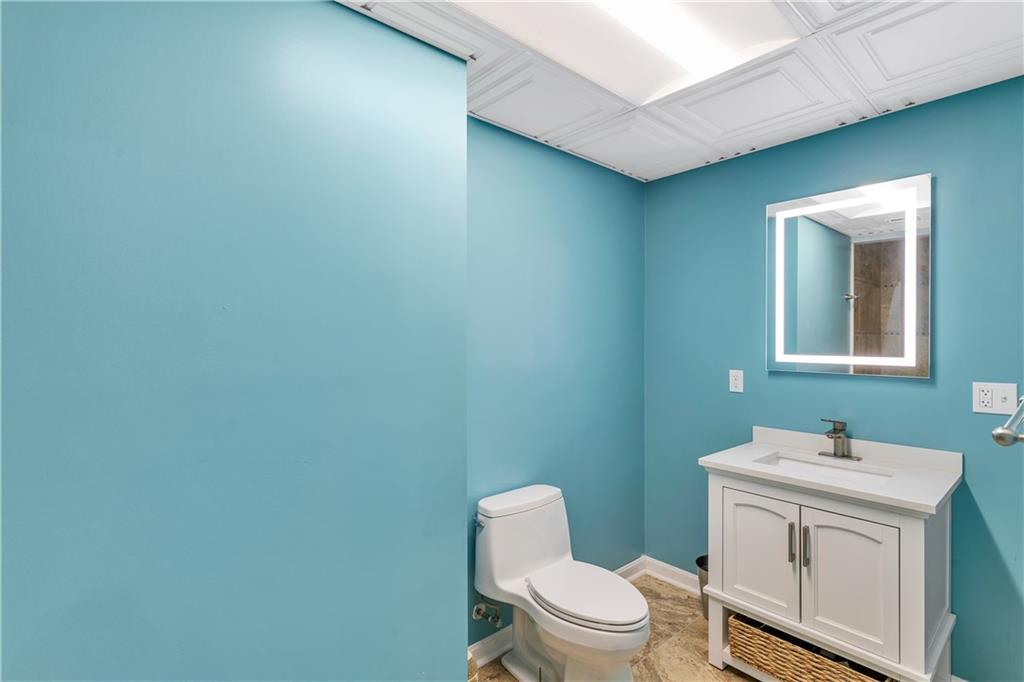 116 James Drive Beaver, PA 15009 - Photo 39 of 44 a bathroom with a toilet sink vanity and mirror