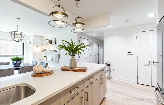 a kitchen with stainless steel appliances a sink and a refrigerator