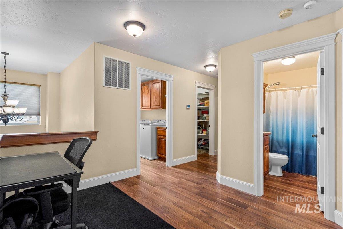 4154 North Tipton Avenue Meridian, ID 83646 - Photo 29 of 50 Hardwood-finish flooring extending through an open hall