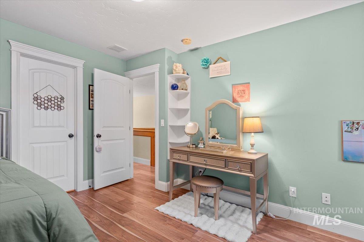 4154 North Tipton Avenue Meridian, ID 83646 - Photo 35 of 50 Interior room featuring light green walls and wood-finish flooring