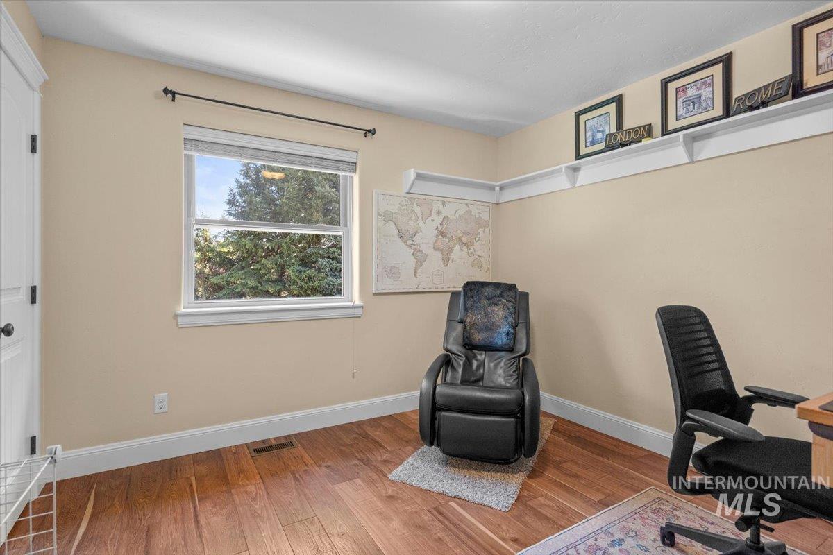 4154 North Tipton Avenue Meridian, ID 83646 - Photo 36 of 50 Warm-toned walls featuring white trim and wood-finish flooring